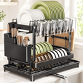 Two-tier dish drying rack in a bright white and cream kitchen